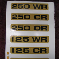 EMBLEM DECAL on CLUTCH COVER 250 125 175 CR OR WR are SOLD INDIVIDUALLY